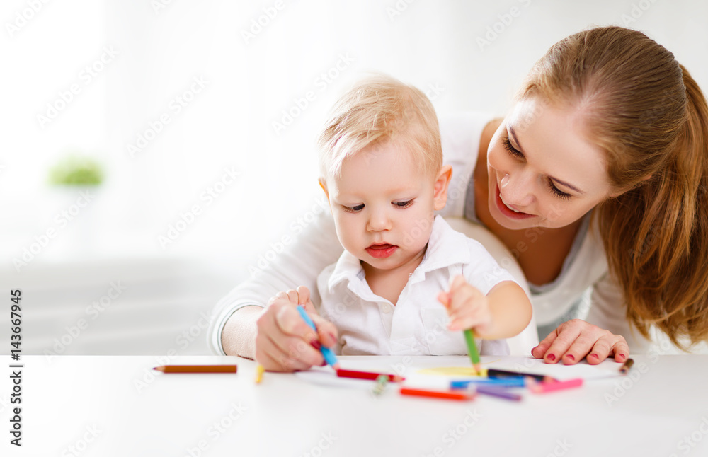 Mother with baby son with colored pencils Mother with baby son with colored pencils