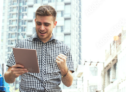 business man holding teblet photo