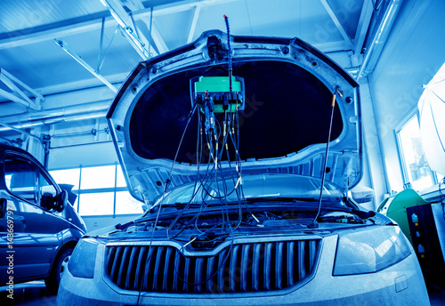 Service station. Car repair wiring.