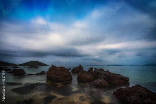 abstract smooth sea and rock with cloudsacep move - can use to display or montage on product