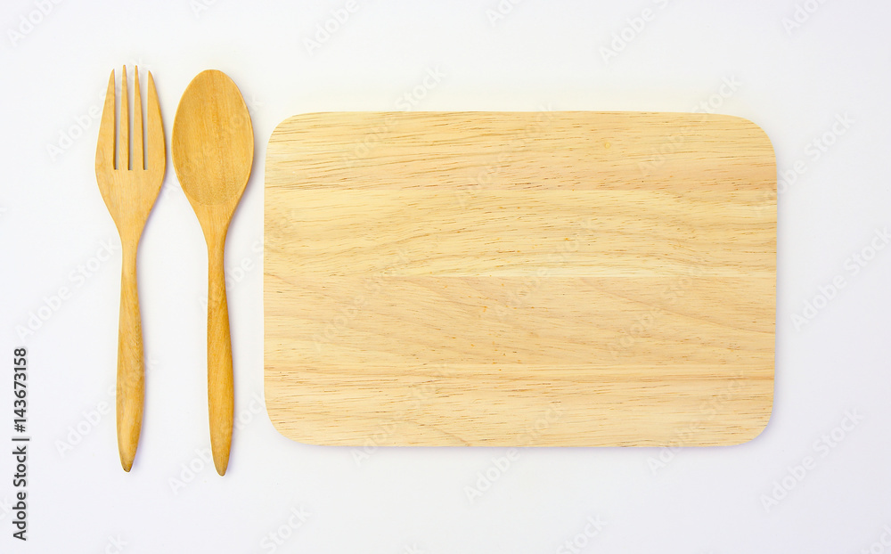 wooden spoon and fork on wooden board against white background wooden spoon and fork on wooden board against white background