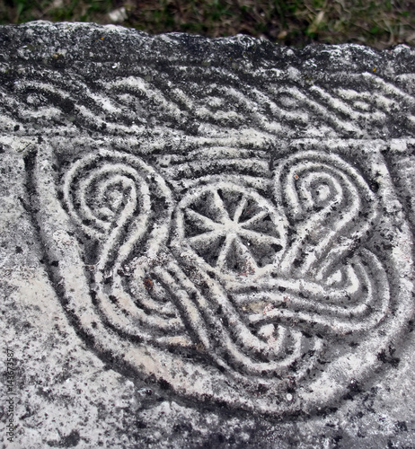 Ancient pagan symbol on the tombstone