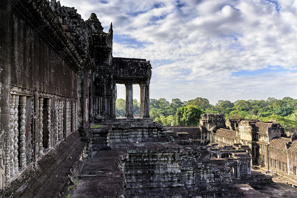 Naklejka premium Angkor Wat terrace. This is a temple complex in Cambodia and the largest religious monument in the world originally constructed as a Hindu temple. It is the country's prime attraction for visitors