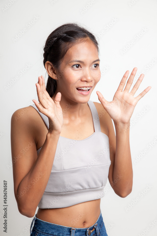 Young Asian woman is surprised and smile. Young Asian woman is surprised and smile.