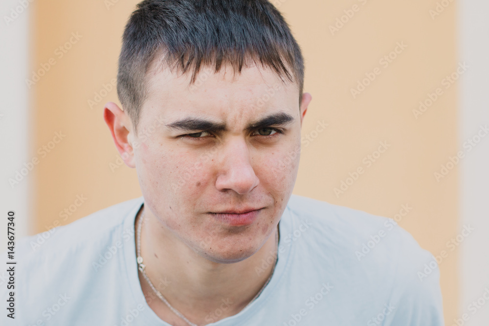Fototapeta premium Portrait of a happy loving man waiting for his girlfriend in the park