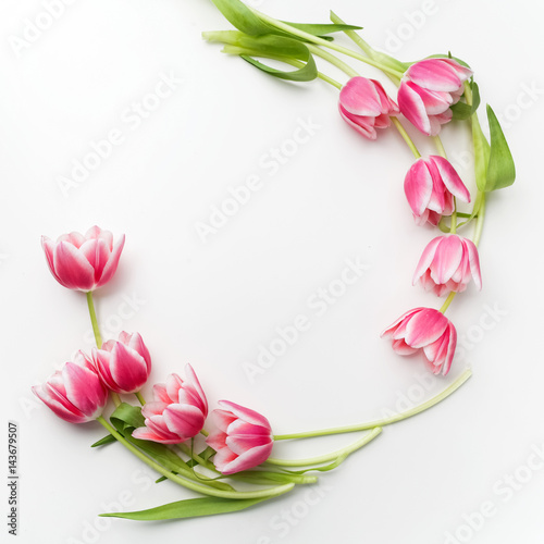 Fototapeta Naklejka Na Ścianę i Meble -  Round frame with tulips flowers. Flat lay. Top view