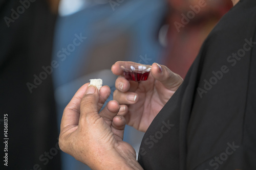 Fotografija adult faithful in Jesus Christ woman in a holy communion.