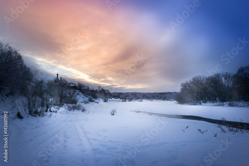 Winter sunrise in forest and river near the russian orthodox church, fantastic winter nature landscape, wallpaper © Mak