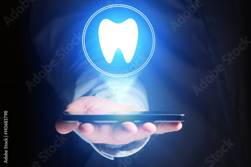 Concept of making an appointement with a dentist on internet - technology concept