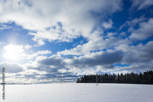 Winter landscape with snow covered countryside. European winter landscape. Blue sky, bright sun and white snow. © Mak