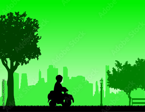 Boy driving a toy car in park, one in the series of similar images silhouette