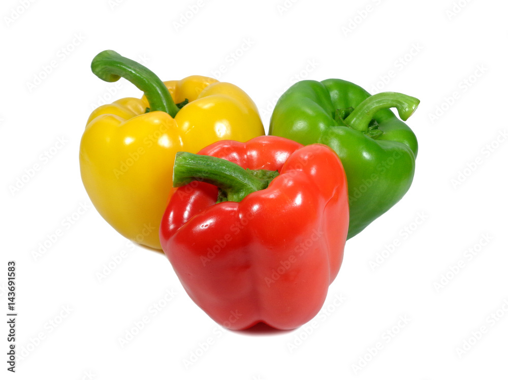 Three vibrant color ripe bell peppers with green stem, one yellow, one green and one red isolated on white background Three vibrant color ripe bell peppers with green stem, one yellow, one green and one red isolated on white background