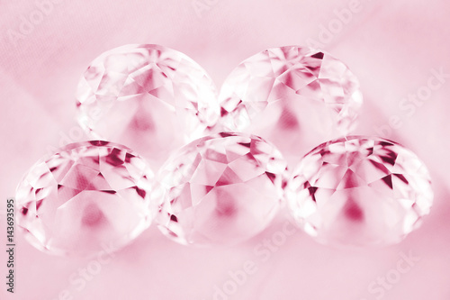 Diamond / View of diamond on canvas background. Pink tone. Shallow depth of field.