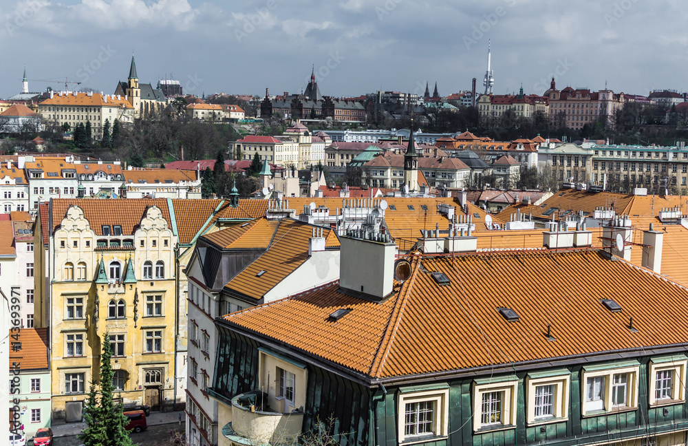 Fototapeta premium The view from VVyshegrad rock to city of Prague in the early spring on a sunny day. Area of the old town in Prague, Czech Republic.