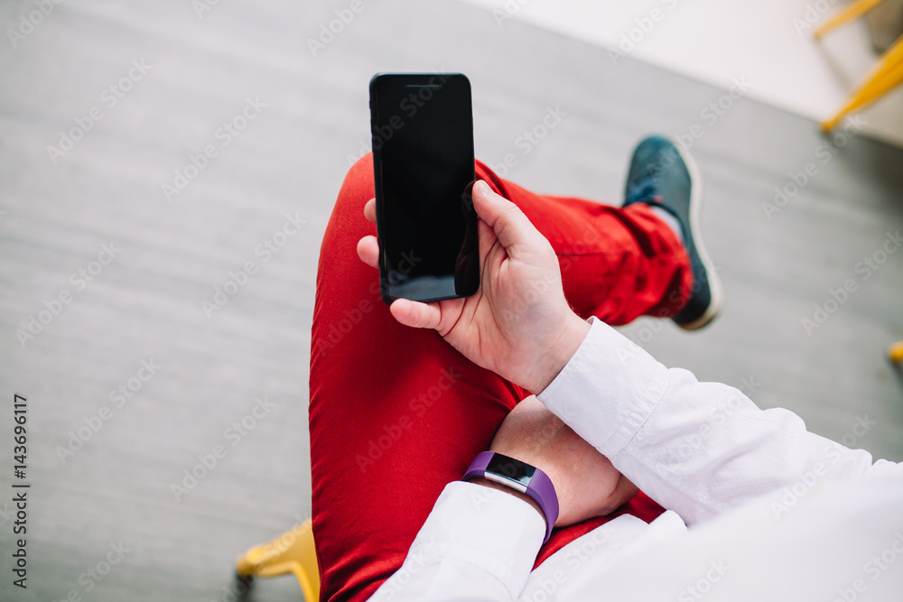 Man using a smartphone. Modern digital concept. Close-up corporate smartphone approach. Man using a smartphone. Modern digital concept. Close-up corporate smartphone approach.