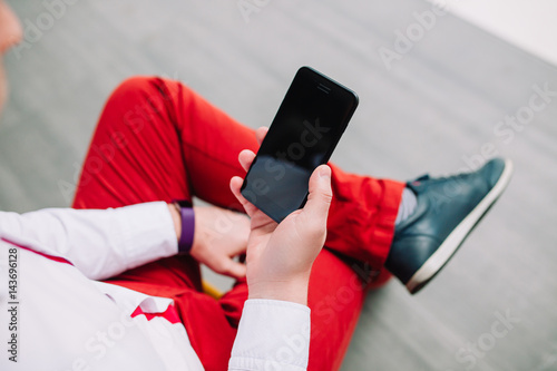 Man using a smartphone. Modern digital concept. Close-up corporate smartphone approach.