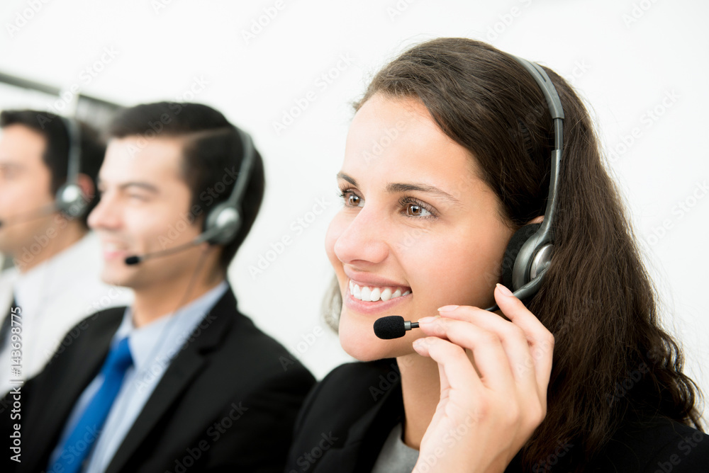 Beautiful smiling woman working in call center Beautiful smiling woman working in call center