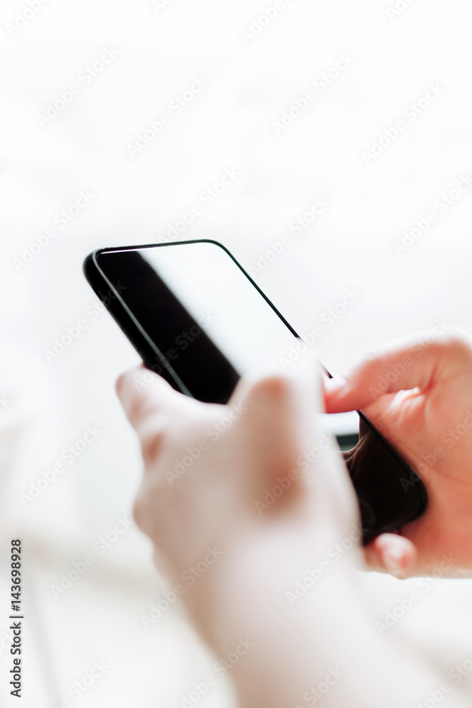 Woman using mobile smartphone. Modern or business concept. Close-up corporate smartphone approach. Woman using mobile smartphone. Modern or business concept. Close-up corporate smartphone approach.