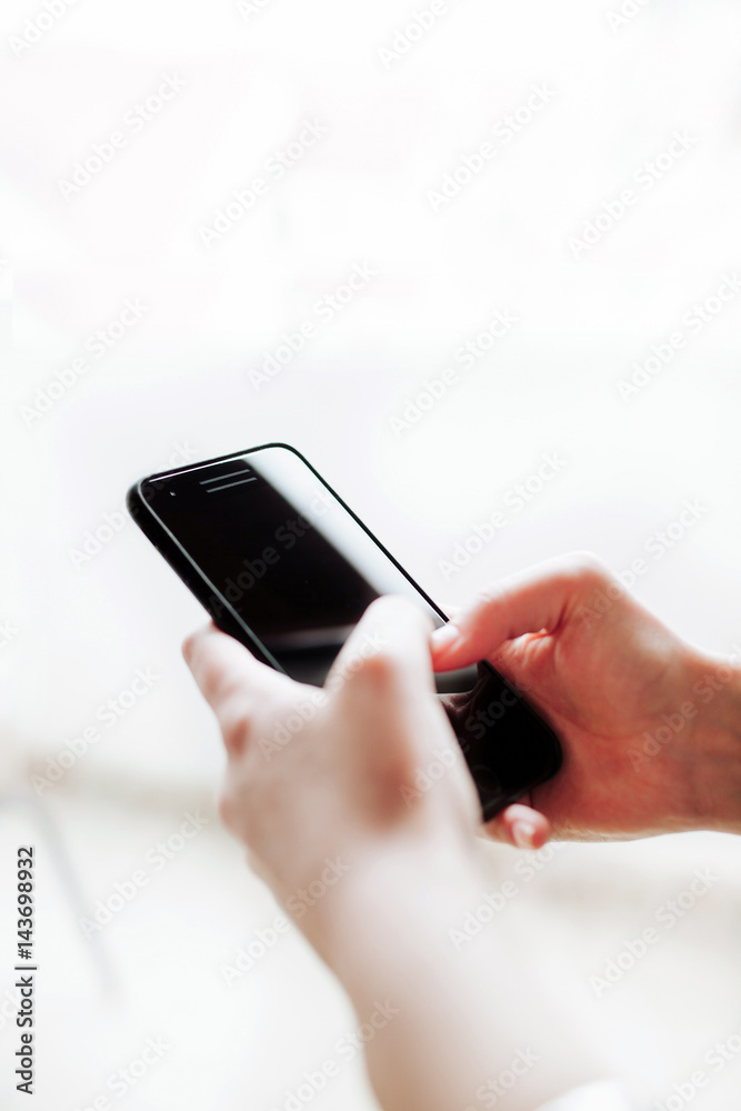 Woman using mobile smartphone. Modern or business concept. Close-up corporate smartphone approach. Woman using mobile smartphone. Modern or business concept. Close-up corporate smartphone approach.