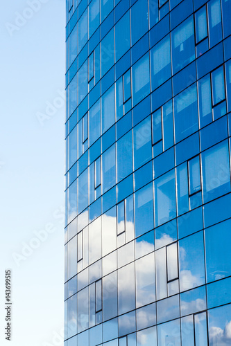 Modern office building, with a clean view of the sky. Economic and financial concept. Facade glass building background and sky view.