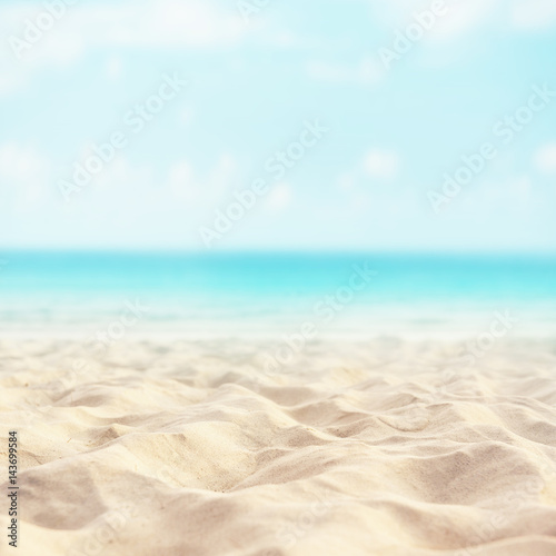 Sand beach tropical with blurred sea sky and sunny background, summer day, copy space or for product. © oatawa