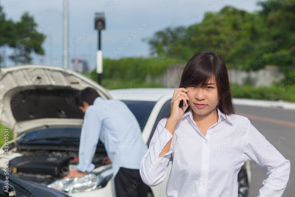 Asia women Stressed Driver Sitting At Roadside After Traffic Accident Asia women Stressed Driver Sitting At Roadside After Traffic Accident