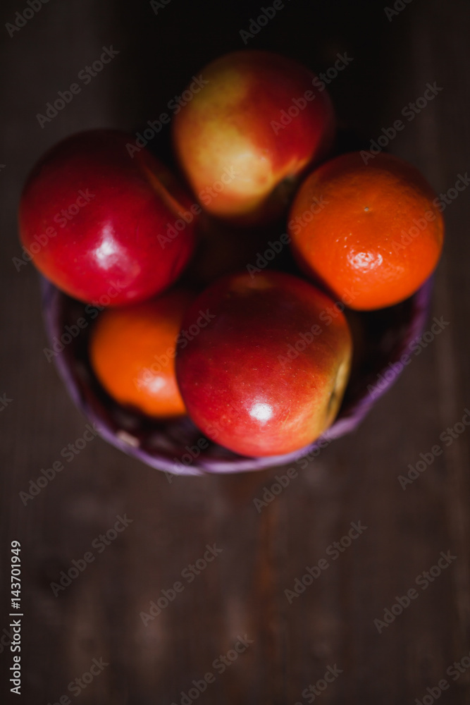 Apples and oranges on old wooden background. Bio food concept. Apples and oranges on old wooden background. Bio food concept.