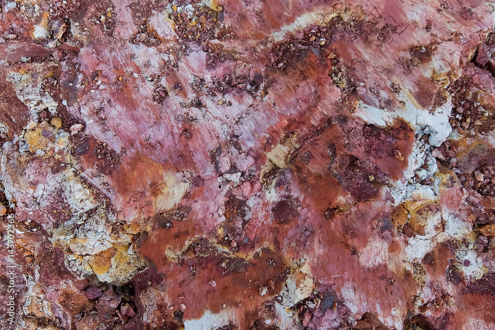 Closeup of abstract textured surfase of red stone mineral Closeup of abstract textured surfase of red stone mineral