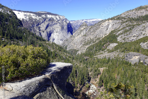 Alpine view with pine forest and granite peaks in the Sierra Nevada Mountains, Yosemite National Park, California