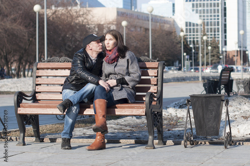 The loving couple walks in the park.