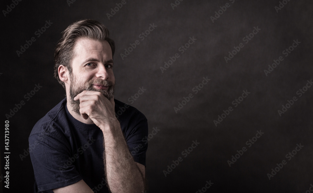 Dark moody portrait of happy caucasian man Dark moody portrait of happy caucasian man