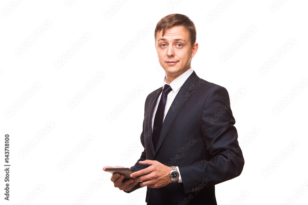 Young handsome businessman is working on his digital tablet isolated on white background Young handsome businessman is working on his digital tablet isolated on white background