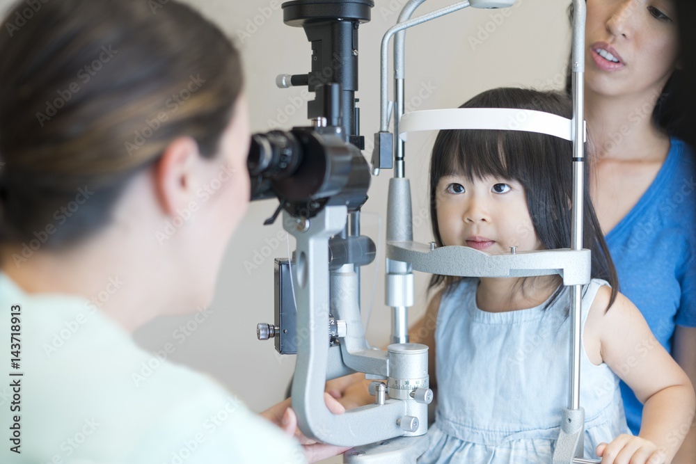 Girl having her eyes tested