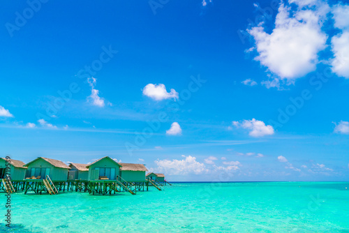 Beautiful water villas in tropical Maldives island .