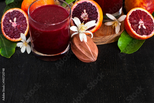 Fototapeta Naklejka Na Ścianę i Meble -  Blood orange juice background