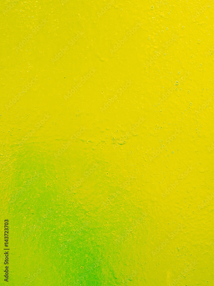 Yellow green metal texture with a roughness and drops of paint surface. Grunge urban background. Yellow green metal texture with a roughness and drops of paint surface. Grunge urban background.