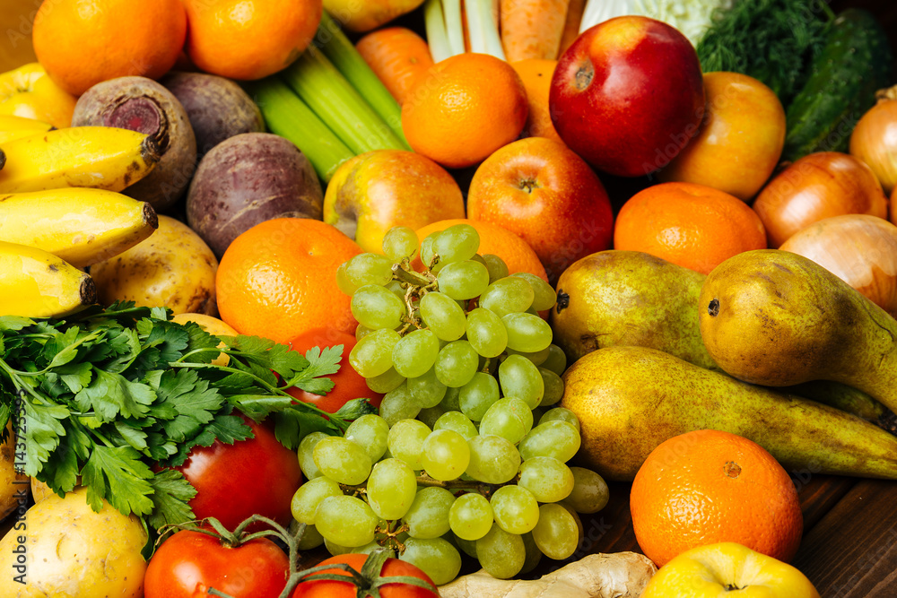 Different fresh raw vegetables and fruits background Different fresh raw vegetables and fruits background