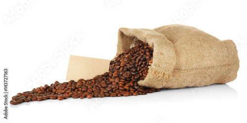 Bag with roasted coffee beans on white background