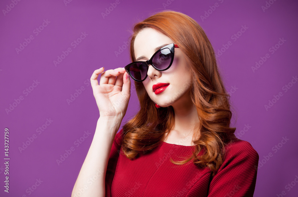photo of beautiful young woman standing on the wonderful purple studio background photo of beautiful young woman standing on the wonderful purple studio background