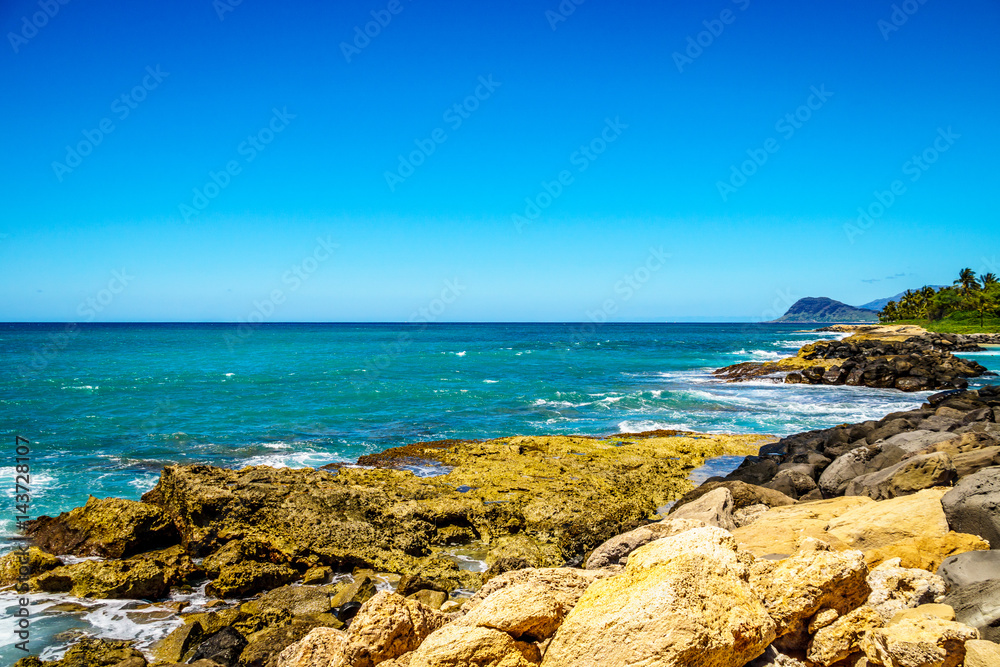 The rocky shoreline of the west coats of the island of Oahu at the resort area of Ko Olina in the island state of Hawaii in the Pacific Ocean