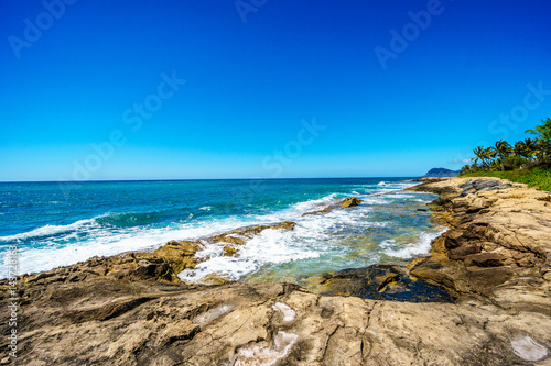 Waves of the Pacific Ocean crashing on the rocks on the shoreline of Ko Olina on the island of Oahu in the island state of Hawaii  © hpbfotos