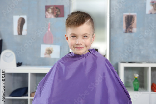 Cute little boy in hairdres...
