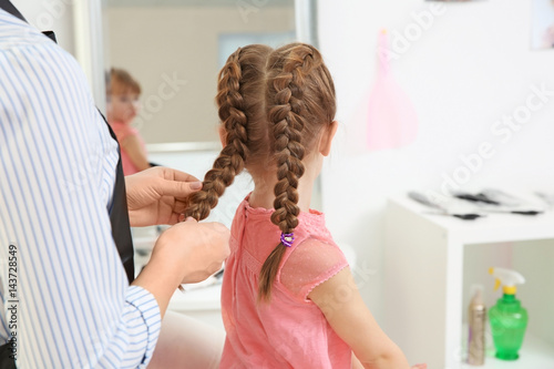 Cute little girl in hairdre...