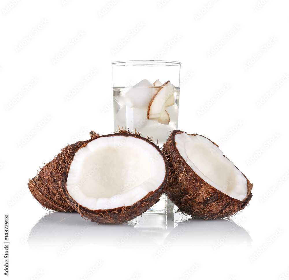 Glass of coconut water and fresh nut on white background Glass of coconut water and fresh nut on white background