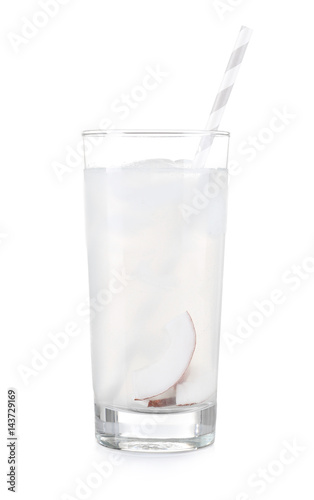 Glass of coconut water on white background