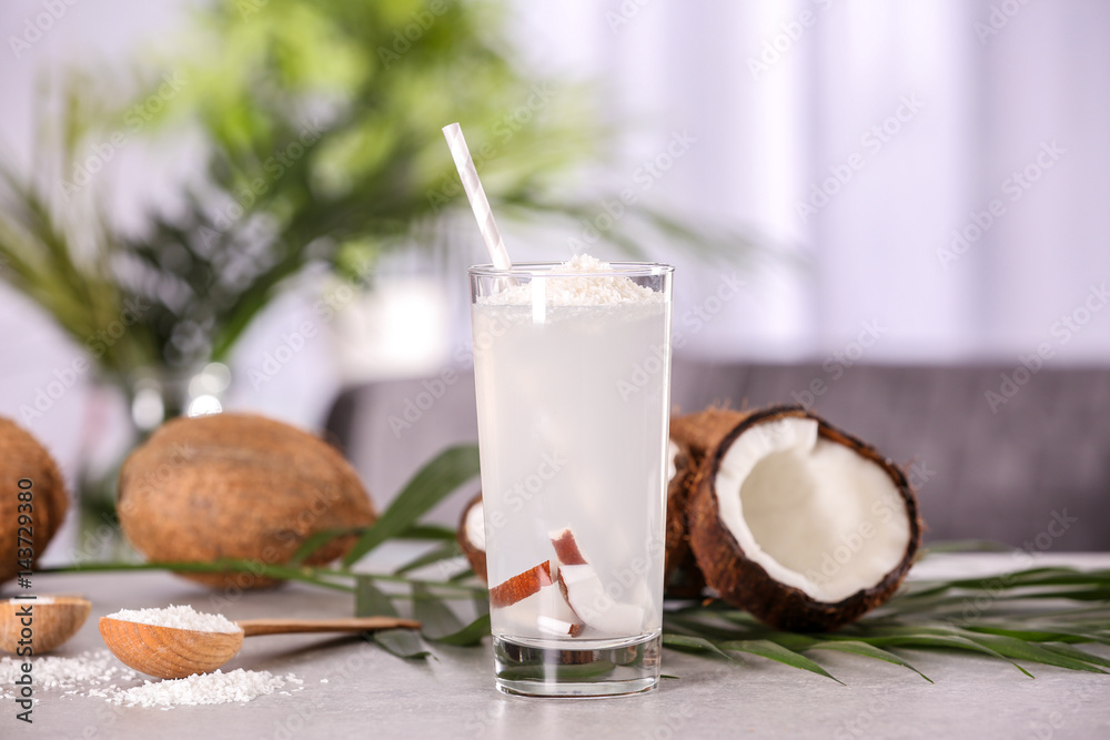 Glass of coconut water on table Glass of coconut water on table