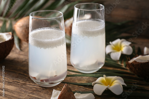 Beautiful composition with coconut water on table