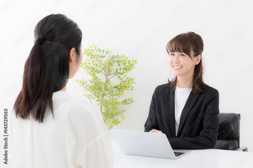 asian businesswomen talking in office asian businesswomen talking in office