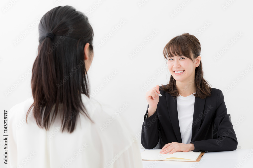 asian businesswomen talking in office asian businesswomen talking in office