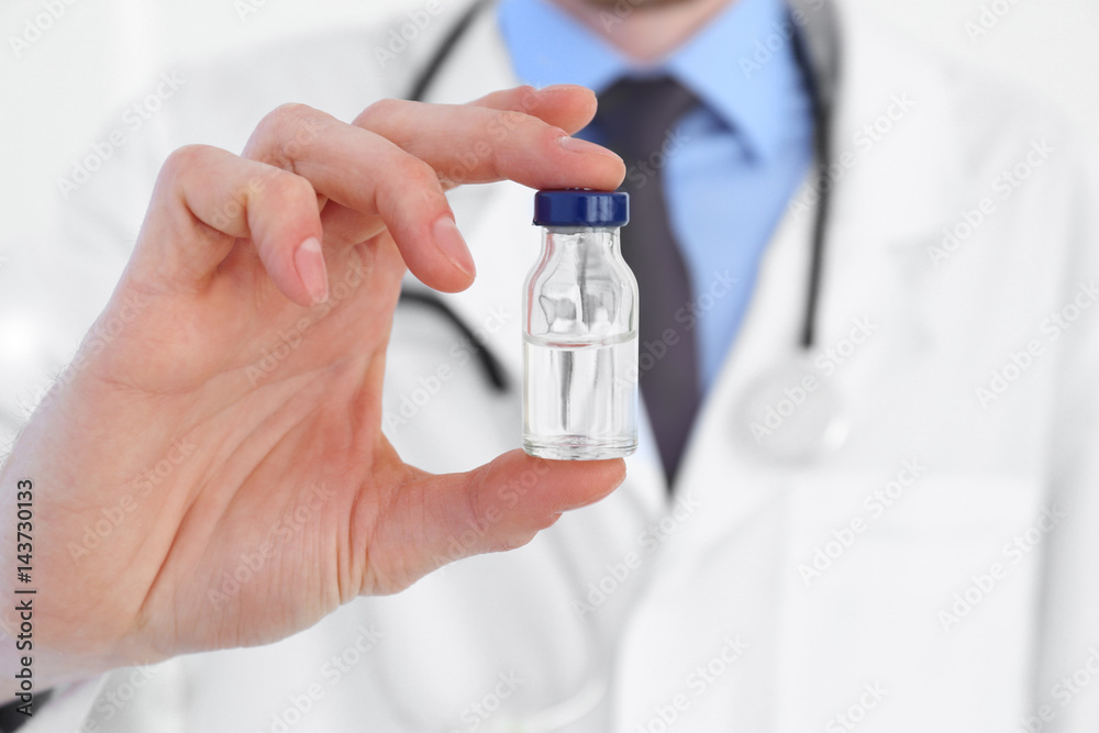 Doctor with medicine for vaccination, closeup